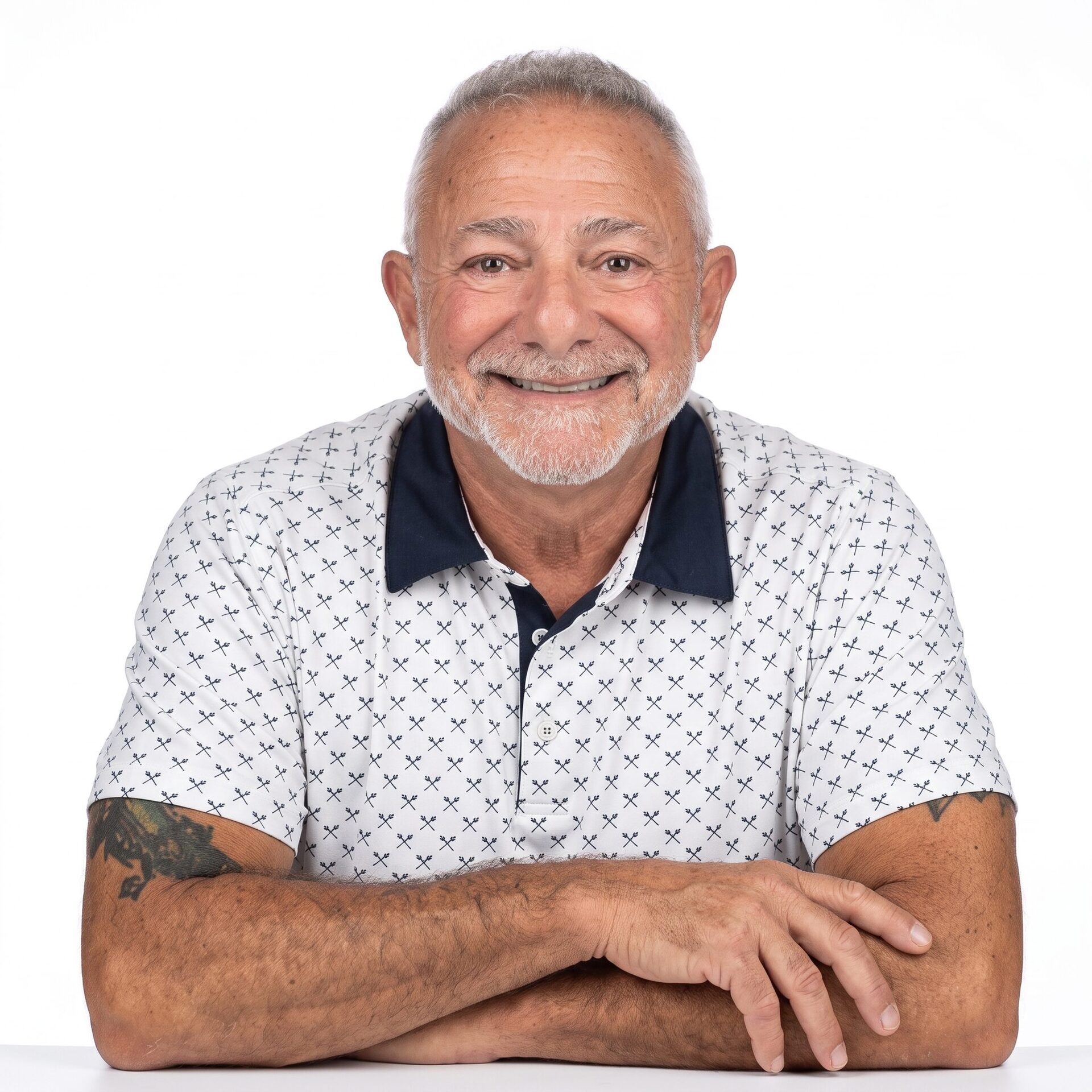 Portrait of an ABC Networks co-founder, an older man with a warm smile.